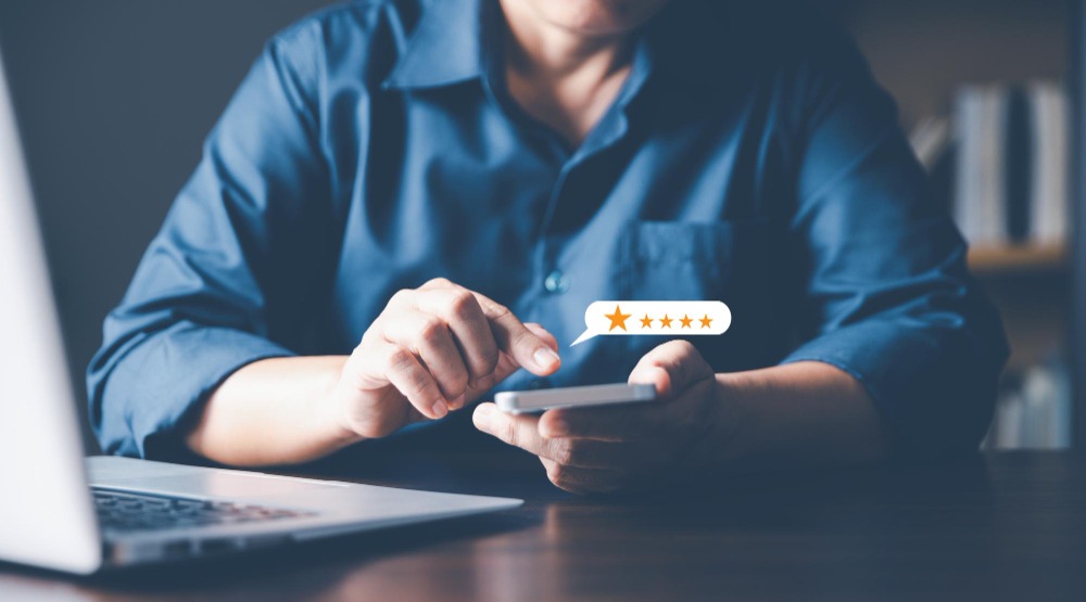 Person checking security company reviews on phone