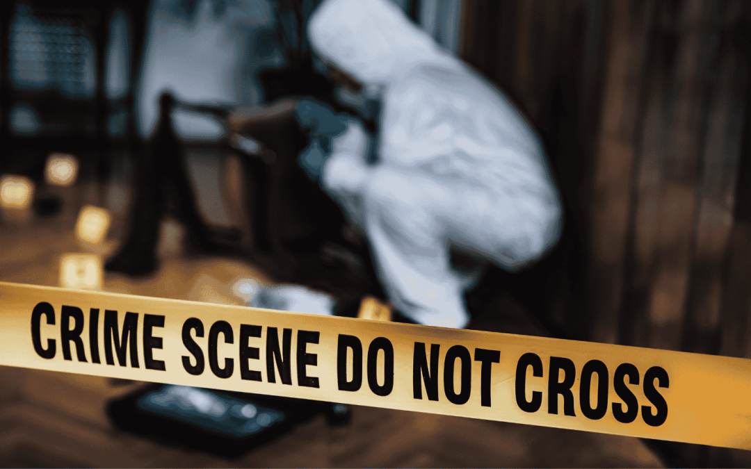 a person in hazmat suit with a yellow tape
